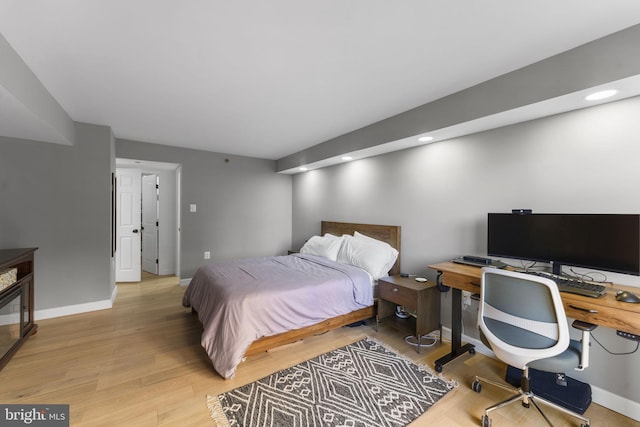 bedroom with light hardwood / wood-style floors