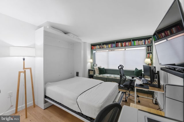 bedroom with light hardwood / wood-style floors