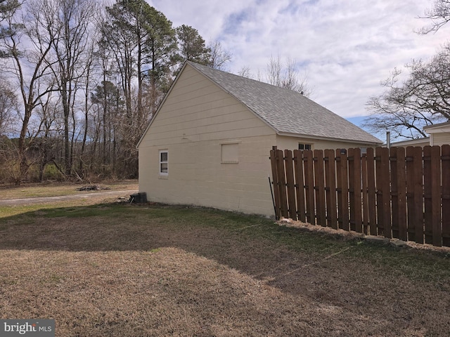 view of side of home featuring a yard