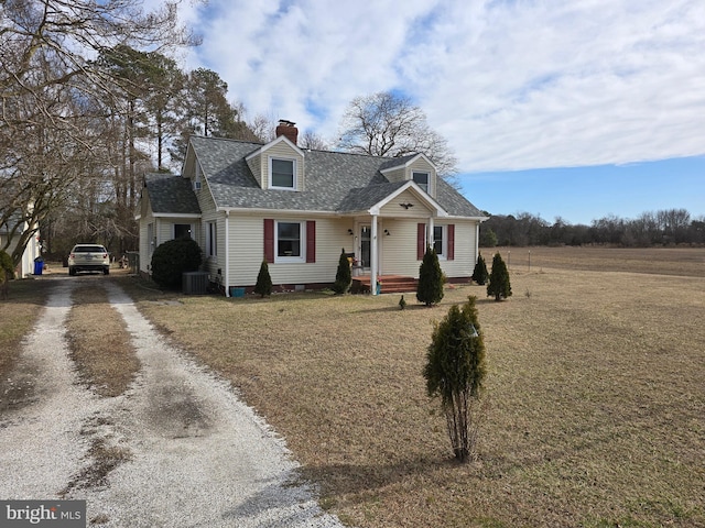 cape cod-style house with central AC unit and a front yard