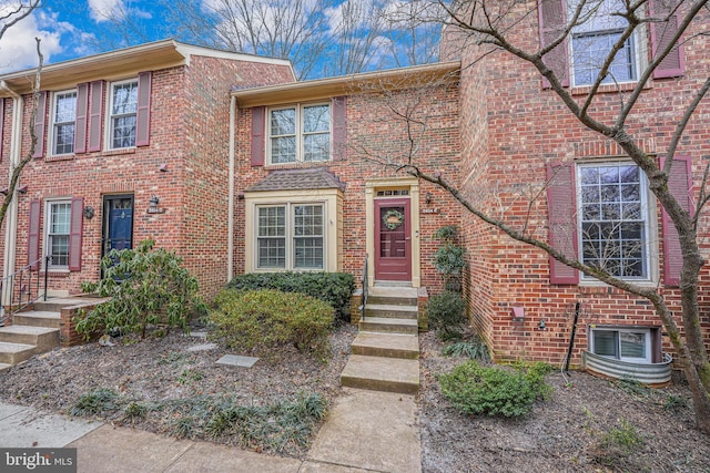 multi unit property with entry steps and brick siding