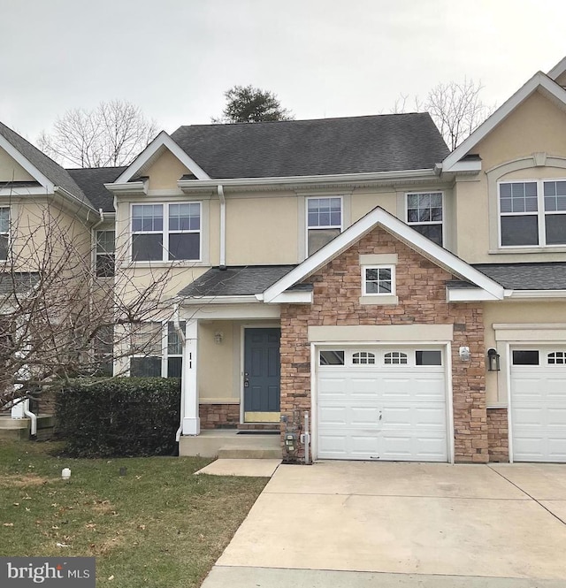 view of front facade featuring a garage and a front yard