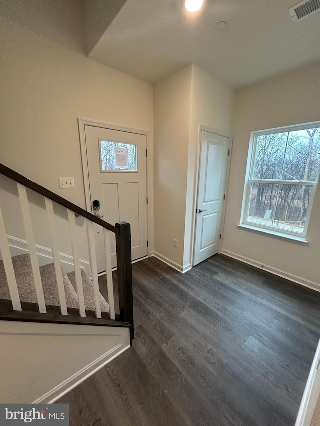 entrance foyer featuring dark hardwood / wood-style floors