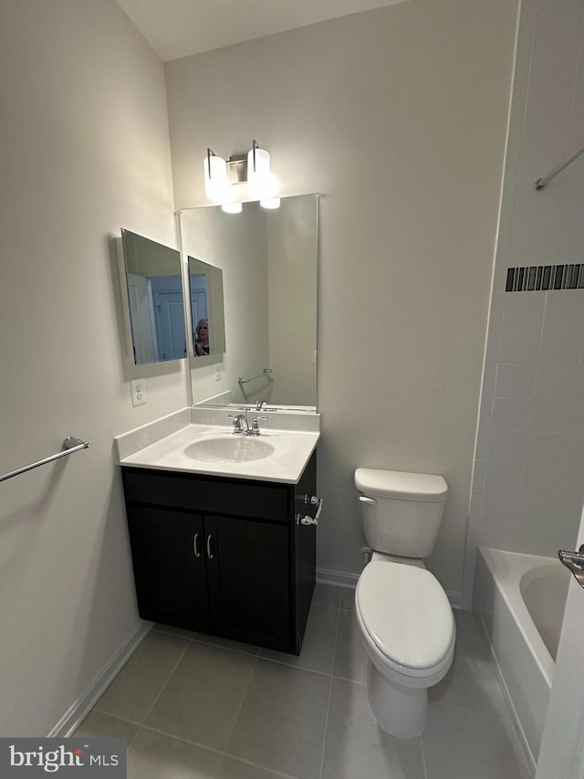 bathroom featuring tile patterned floors, toilet, and vanity