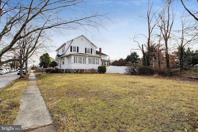 view of home's exterior with a lawn