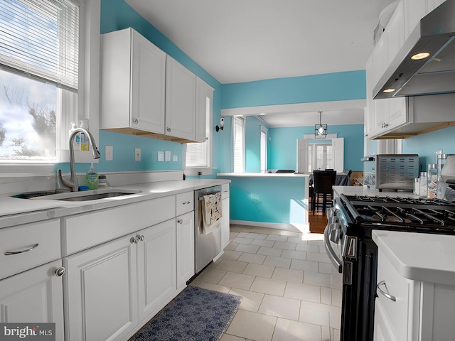 kitchen with sink, light tile patterned floors, white cabinetry, stainless steel appliances, and exhaust hood