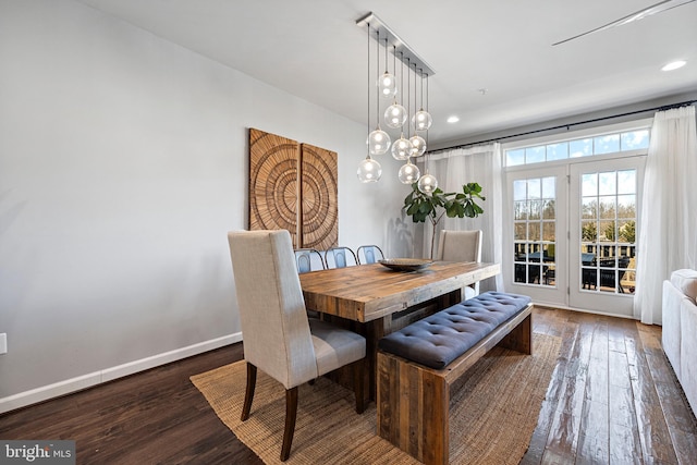 dining space with wood-type flooring, baseboards, and recessed lighting