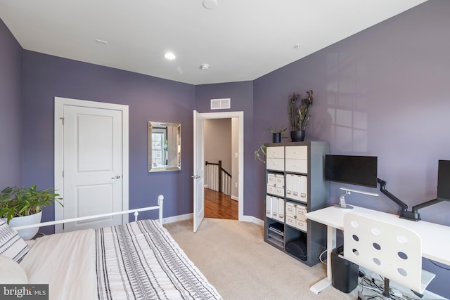 carpeted bedroom with baseboards and visible vents