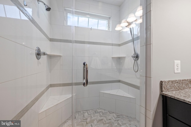 bathroom with vanity and a shower stall