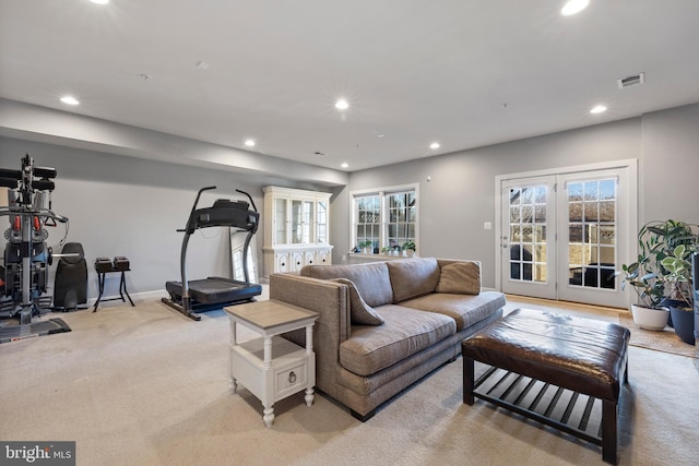 living room with baseboards, visible vents, light colored carpet, and recessed lighting