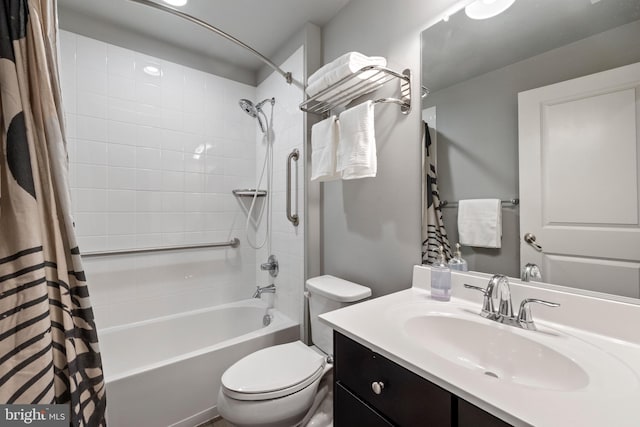 bathroom with vanity, toilet, and shower / bath combo with shower curtain