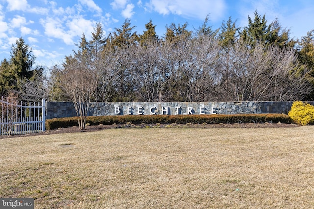 exterior space featuring fence and a front lawn