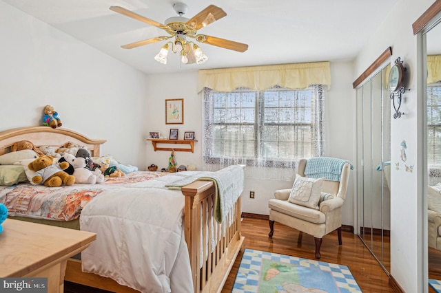 bedroom featuring hardwood / wood-style flooring and ceiling fan