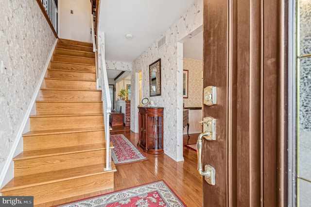 stairs with wood-type flooring