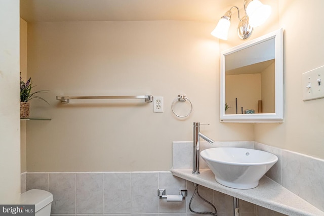 bathroom featuring sink and toilet