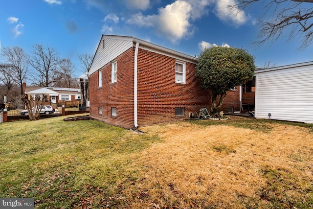 view of home's exterior with a lawn