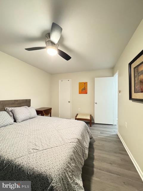 bedroom featuring hardwood / wood-style flooring and ceiling fan