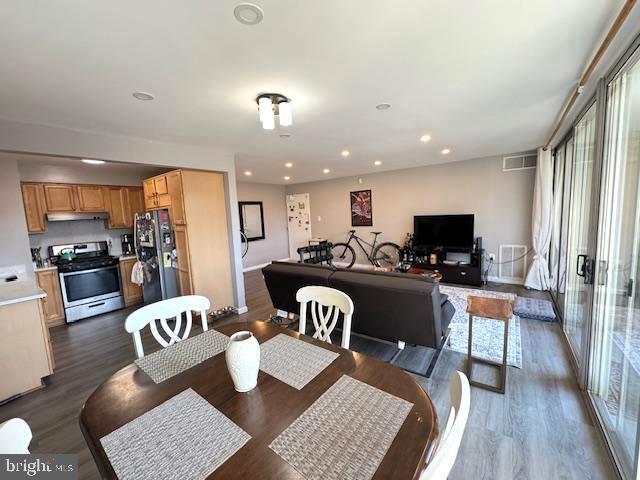 dining area with dark wood-type flooring