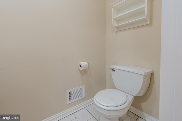 bathroom featuring toilet and tile patterned flooring