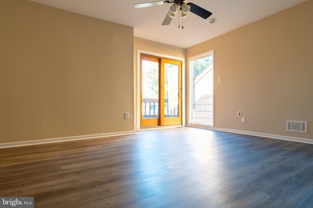 unfurnished room featuring ceiling fan and dark hardwood / wood-style flooring