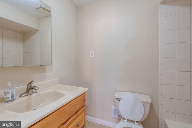 full bathroom featuring vanity, separate shower and tub, and toilet