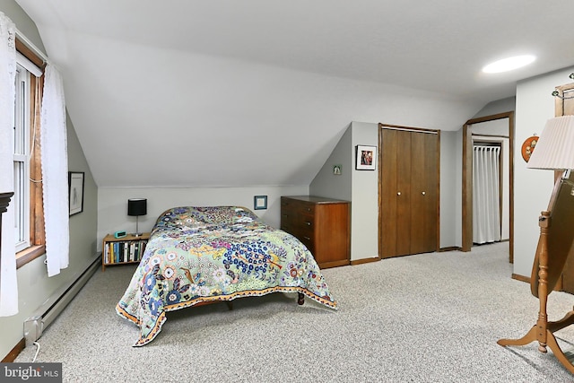 bedroom featuring a baseboard heating unit, vaulted ceiling, carpet flooring, and baseboards