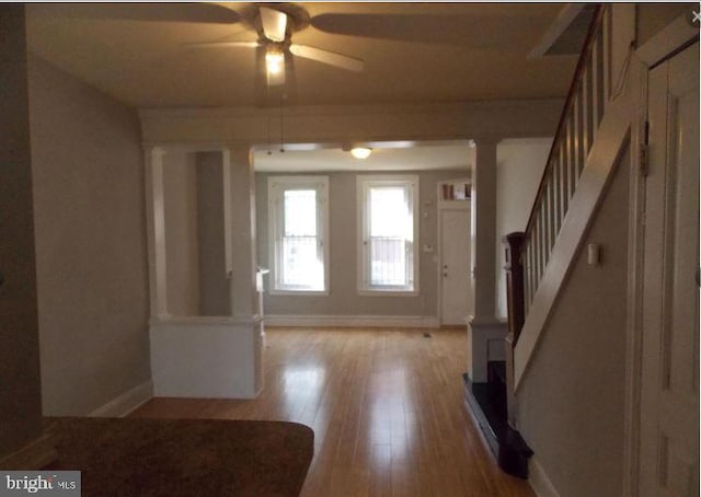 entrance foyer with ceiling fan and light wood-type flooring