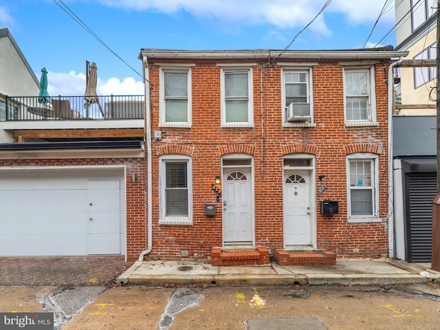 multi unit property with cooling unit and a garage