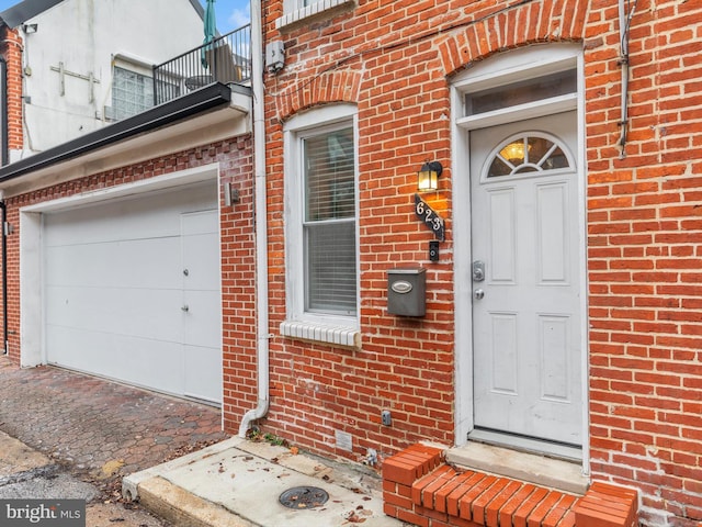 entrance to property with a balcony