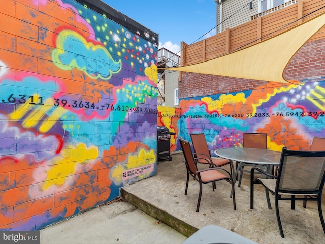 view of patio with a grill