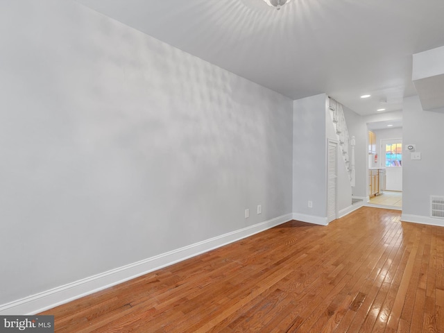 spare room with light hardwood / wood-style flooring