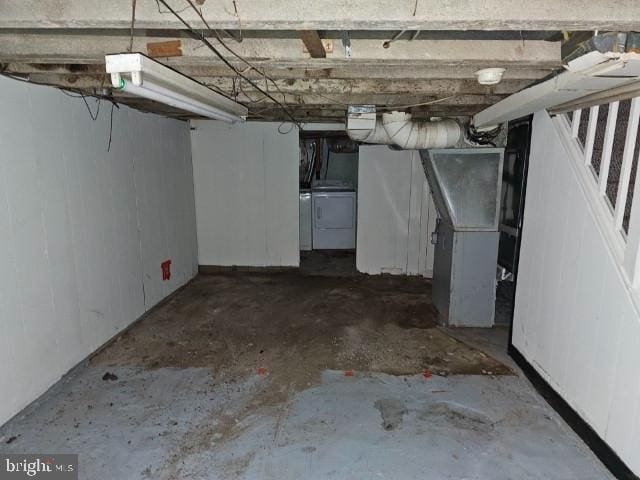 basement with washing machine and clothes dryer