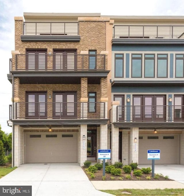 view of front facade featuring a balcony and a garage