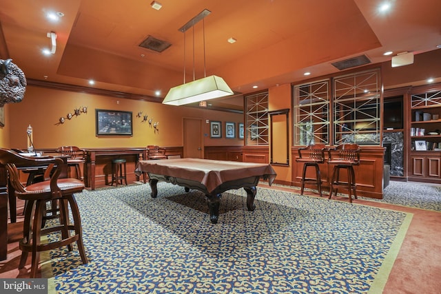 playroom featuring carpet flooring, a tray ceiling, bar area, and billiards