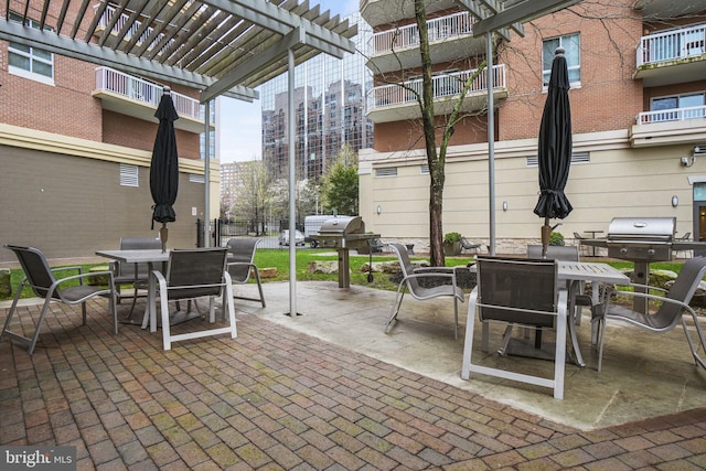 view of patio / terrace with grilling area and a pergola