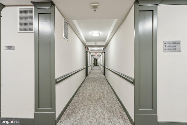 hallway with light carpet