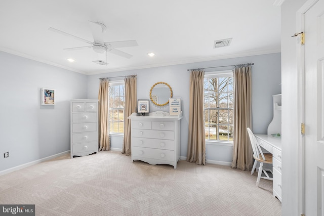 unfurnished bedroom with carpet floors, visible vents, ornamental molding, a ceiling fan, and baseboards