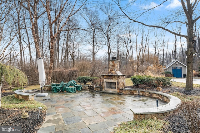 view of patio / terrace with an outdoor stone fireplace