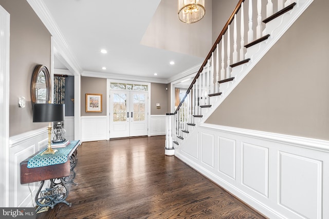 entryway with recessed lighting, dark wood-type flooring, stairs, french doors, and crown molding