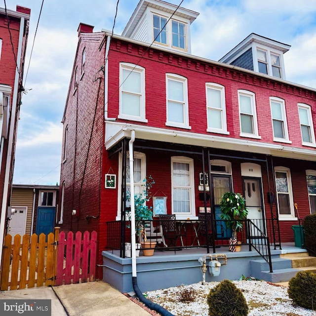 multi unit property featuring a porch