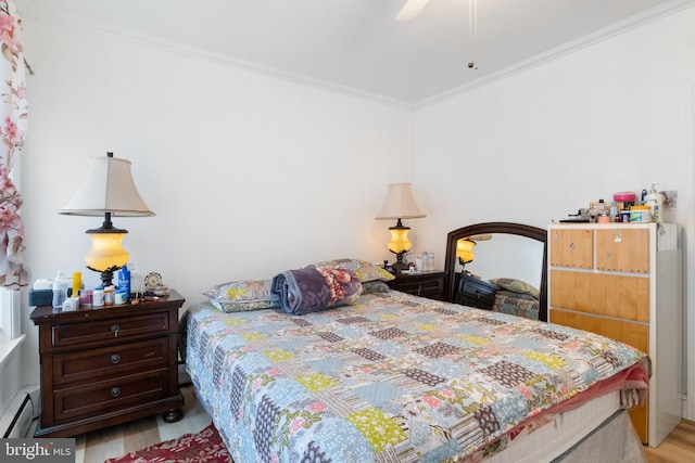 bedroom featuring crown molding, ceiling fan, a baseboard radiator, and light hardwood / wood-style floors