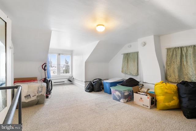 additional living space featuring carpet floors and vaulted ceiling