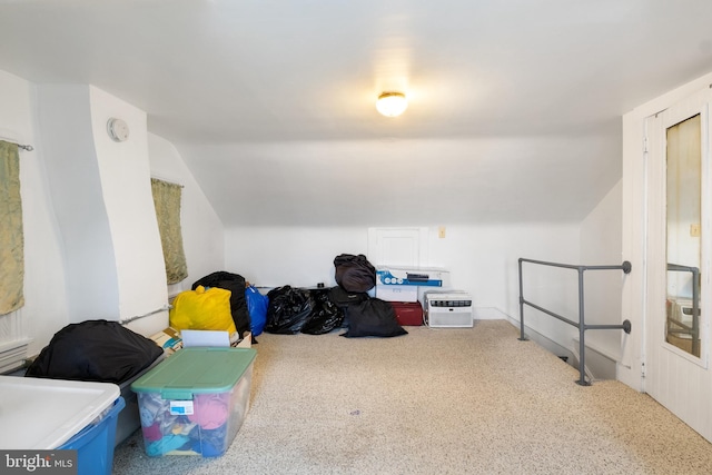 bonus room featuring lofted ceiling and carpet flooring