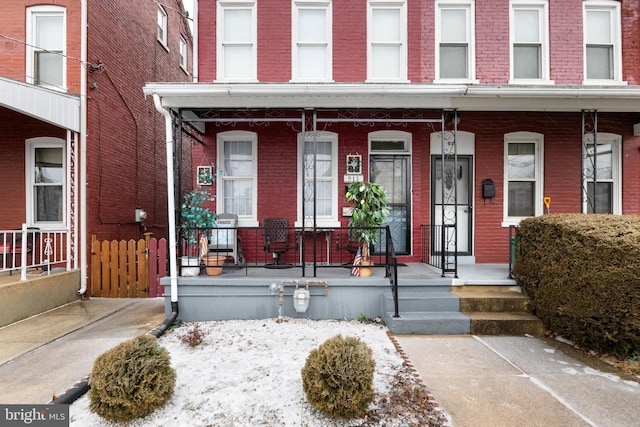 view of exterior entry featuring a porch