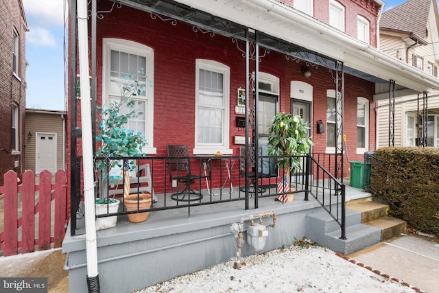 entrance to property featuring covered porch