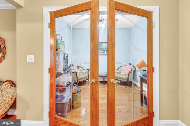 corridor featuring hardwood / wood-style flooring and french doors