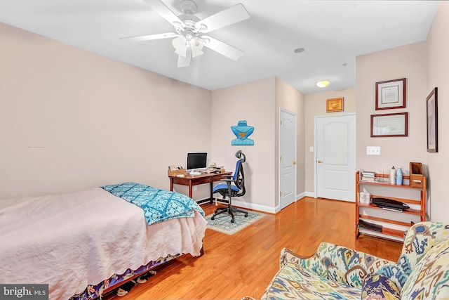 bedroom featuring hardwood / wood-style floors and ceiling fan