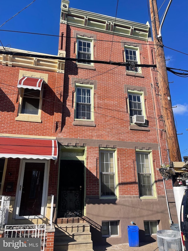 view of building exterior with cooling unit