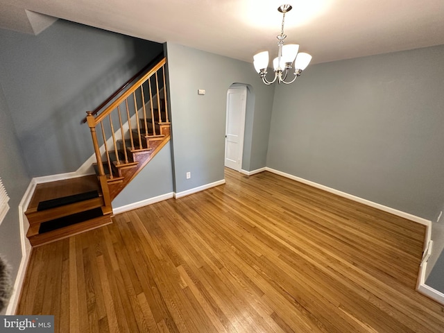 interior space with hardwood / wood-style flooring and a chandelier