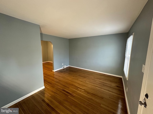 empty room featuring dark hardwood / wood-style floors